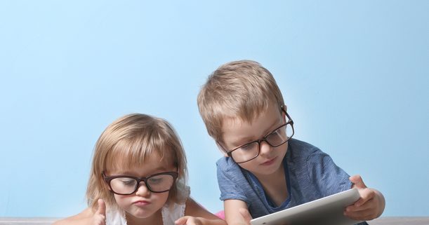 children looking at tablets