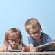 children looking at tablets